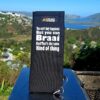 A braai grid handle sleeve / sock - Saying on it - "You can't buy happiness but you can braai and that's the same kind of thing"